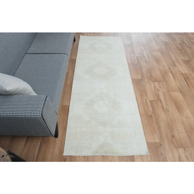 This vintage hand-knotted area rug is a semi-antique vintage area rug. The '70s Eastern region of Anatolian's unique rug...