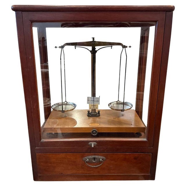 Beautiful antique scale originally from Germany. The front glides up for access and the glass and hardware are original....