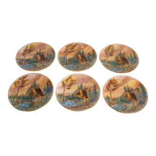 Circa 1900 American Impressionist Style Forest Cabin Landscape Motif Hand-Painted Porcelain Gilded Rim Appetizer Plates - Set of 6 For Sale