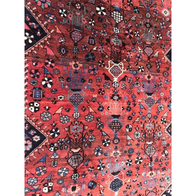 Very beautiful late 19th century runner with beautiful tribal design and a red field color with blue, green, purple,...