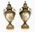 A beautiful and monumental Paris porcelain ormolu mounted three piece garniture set with hand-painted scenes and delicate...
