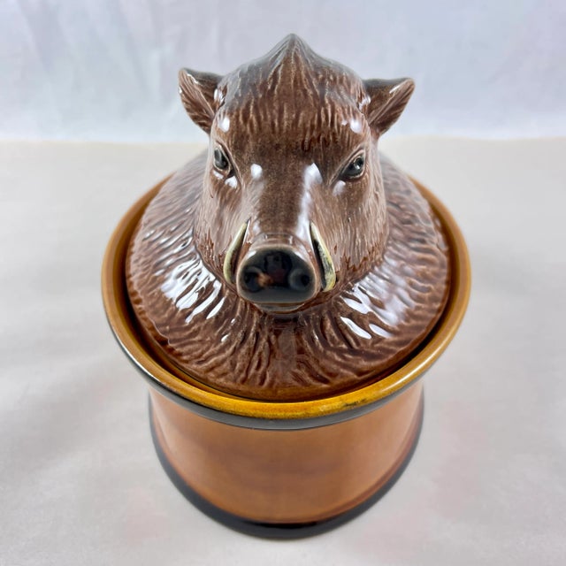 From the Faiencerie Subtil, Portugal, a Mid-Century pate terrine, the cover formed as a sitting Boar, circa 1960s to early...