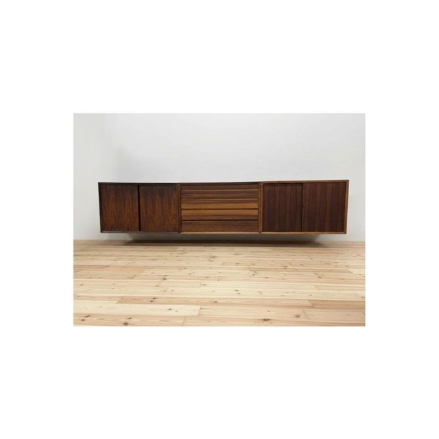 Wall-mounted sideboard by Poul Cadovius from the 1960s. The sideboard consists of one sliding doors cabinet module, one...