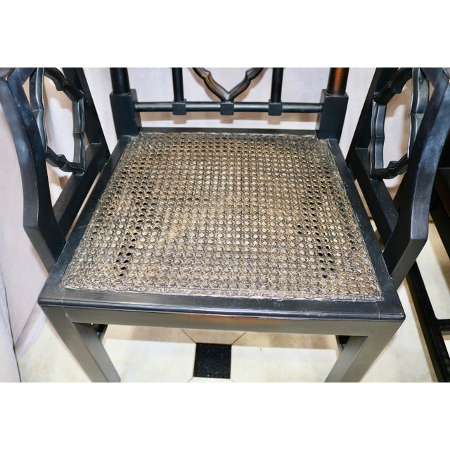 Vintage Chinoiserie Black Carved Wood Arm Chairs With Caned Seat - A Pair For Sale - Image 4 of 4