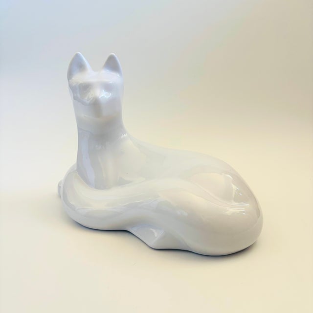 A large vintage postmodern ceramic cat sculpture. Lovely simplified features, finished in a glossy white glaze. Made in...