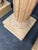 A striking set of four monumental Corinthian style architectural columns crafted in pine with richly carved capitals and...