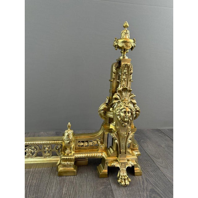 Pair of gilt bronze fire dogs, louis xvi style a superb pair of gilt bronze fire dogs, made in the late 19th century in...