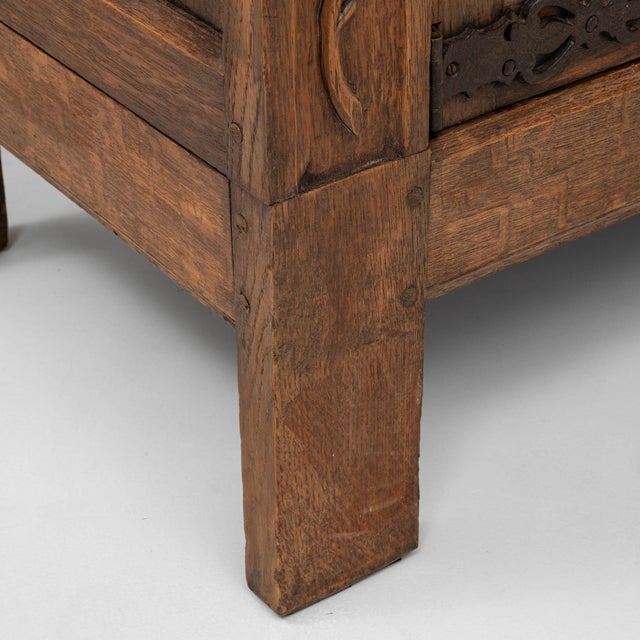 This 1920s French Gothic oak cabinet presents an exceptional display of period craftsmanship, defined by its intricate...