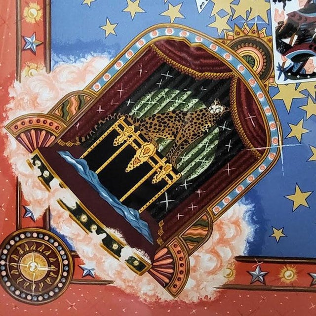 Elevate your space with this stunning, professionally framed vintage Hermès "La Magie" silk scarf, originally released in...