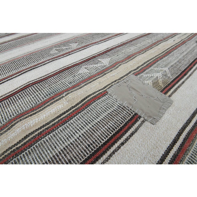 Vintage Hand-Knotted area rug is a semi-antique vintage area rug. The '70s Eastern region of Anatolia's unique rug is...