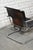 Cantilever armchair manufactured by Arrben, Italy. Made of bend tubular frame and thick sadle leather. with age and usage...