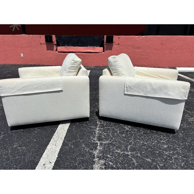 Classic and striking mid century club chair pair. Plush upholstery, rigid frames, and smooth rolling wheels. Maker...