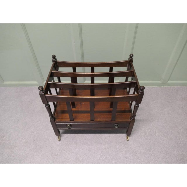 English Walnut Canterbury Magazine Stand This is a pretty little piece, it stands on neat brass casters and has elegant...