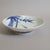 A refined Japanese porcelain shallow bowl featuring a hand-painted bamboo motif in underglaze cobalt. The composition is...