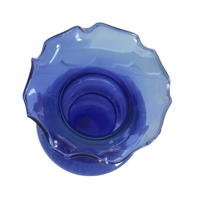 This vintage COBALT Blue BLOWN Glass Vase stands at 10 inches high and features a ruffled edge, adding a unique and...