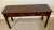Likely produced in the 1980s or 1990s, this Ethan Allen console table has classic, stately lines and a beautiful finish....