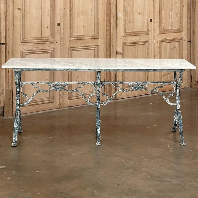 19th Century French Cast Iron Cafe Table ~ Sofa Table with Carrara Marble is a splendid example of the Belle Epoque,...