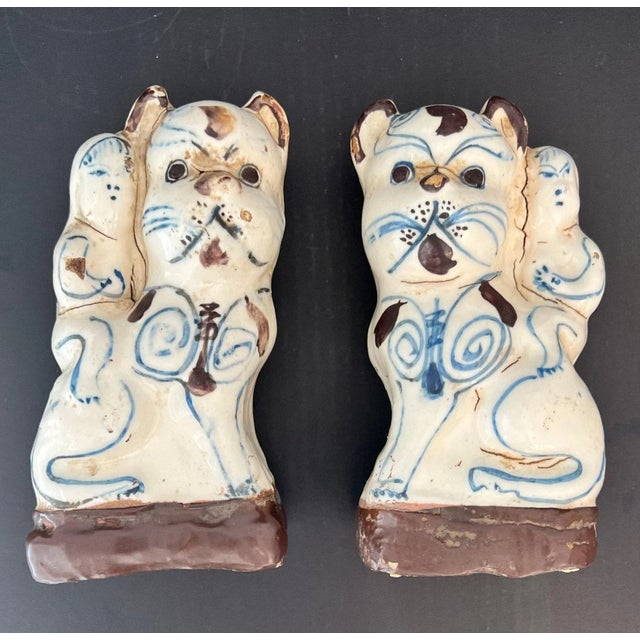 A pair of antique Cizhou-type cream glazed cat (māo) incense stick holders. Dating to the early Qing - possibly late Ming...