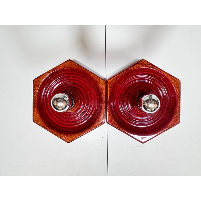 This pair of wall lights from Hustadt Leuchten was manufactured in the 1970s. with its distinctive hexagonal shape,...