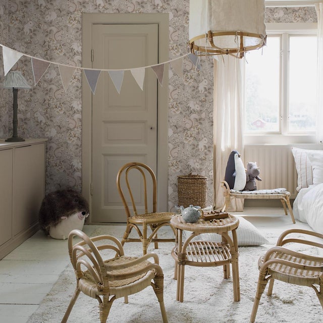 A whimsical pattern of woodland animals and fanciful florals, Boråstapeter’s Magic Forest wallpaper has a storybook charm...