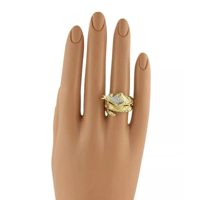 This is a magnificent snake ring, it is a glamorous interpretation of an opulent design with timeless appeal and celebrity...