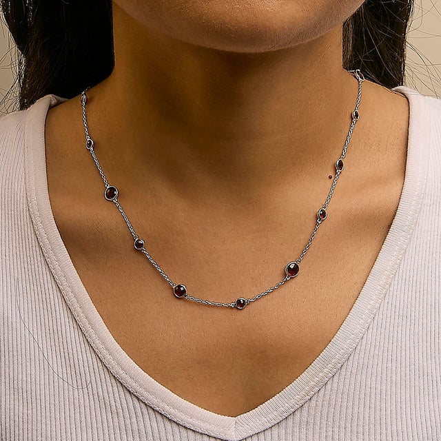 Exuding elegance, this 22-inch necklace, masterfully crafted from rhodium-plated .925 sterling silver, serves as a...