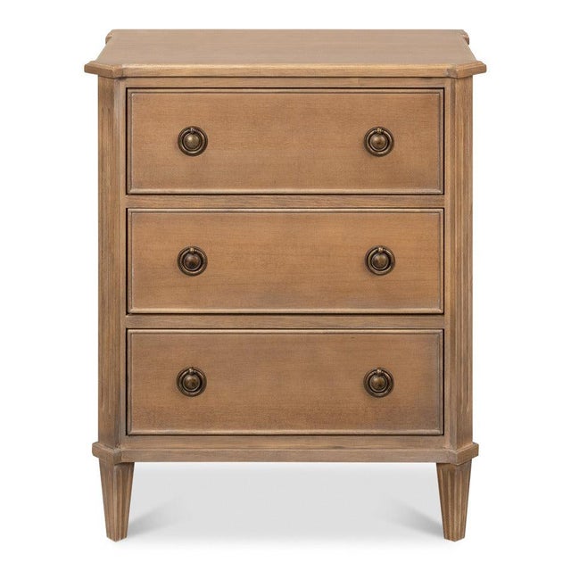 Three full-width drawers sit between canted corner stiles, with shallow flutes continuing down into tapered legs. Two...