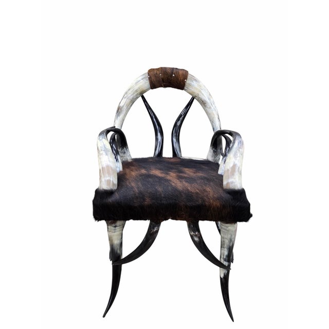 Antique Rustic Western Steer Horn Chair with Natural Cowhide Seat An exceptional example of American rustic craftsmanship,...