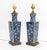Pair of Chinese Blue and White Ceramic Vases Mounted as Lamps, with floral design on carved wood bases. 20.5" H x 5" W x...