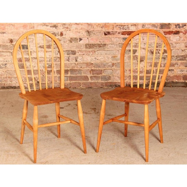 Set of 2 of mid century Ercol chairs made in elm and beech circa 1950s. Original black labels. Excellent restored...