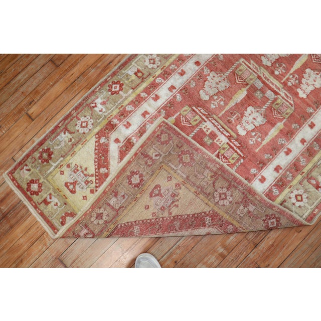An antique Turkish Melas Runner with a prayer design in predominant soft red Measures: 3'5'' x 13'.