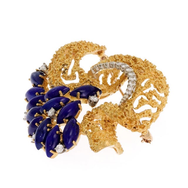 This is a gorgeous Estate brooch, crafted from 18k yellow gold featuring a rough textured design ribbon bow accented with...