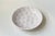 A stylish white glazed dish or centerpiece bowl decorated with oak leaves in relief. Hand-made by the danish ceramist...