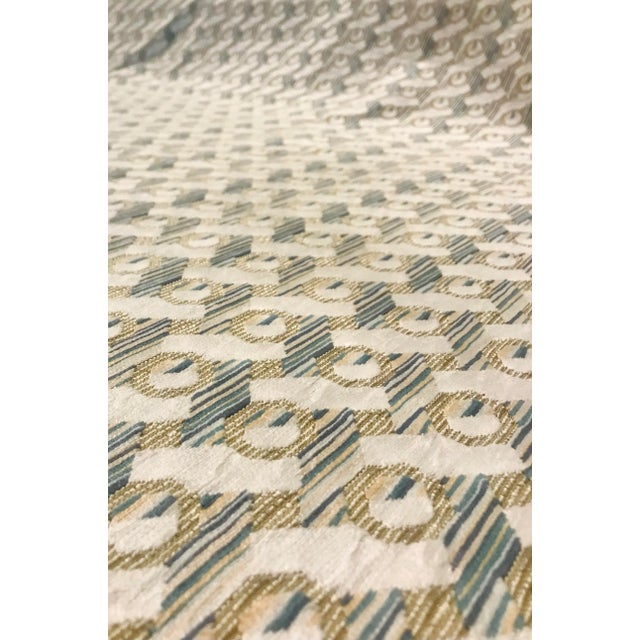 This elegant modern fabric is suitable for upholstery or accessories . The color has an beige base with a continuous...