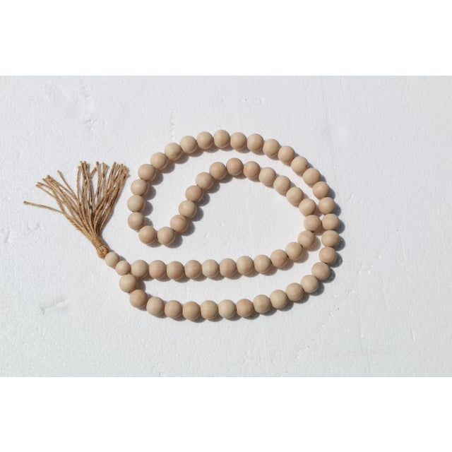 Decorate, accessorize or simply wear this Blessing Bead Necklace with Tassel to help find your inner calm. Crafted out of...
