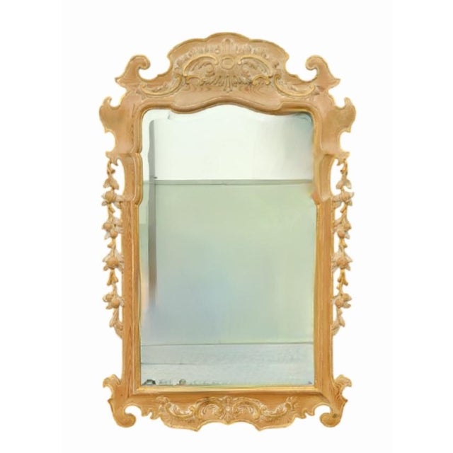 A stunning intricately carved wood Rococo style wall mirror. This mirror is stunning and so well made. The mirror is made...