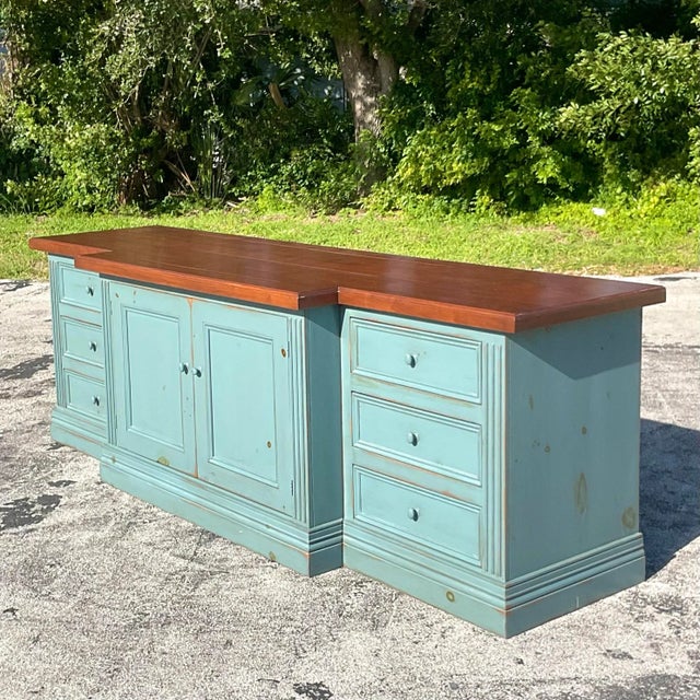A fantastic vintage Boho long credenza. A chic matte blue wash cabinet with a natural wood top. Monumental in size and...