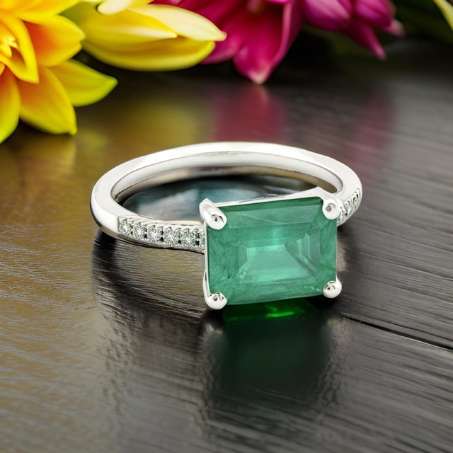 Natural Finely Faceted Quality Emerald and Diamond Ring Size 6.5 and resizable and set in 14k White Gold with a total ct...
