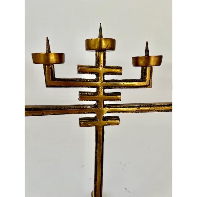 Unique vintage 1960's brutalist candelabra. Made from heavy solid brass with a cross design and raised base.. Holds five...