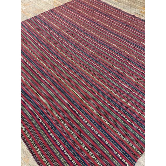 This mid-20th-century Turkish Decorative textile is an exceptional example of Anatolian tribal flat-weaving craftsmanship....