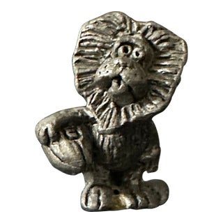 Vintage 1970s Hand Cast Pewter Lion Holding a Football Figurine For Sale