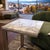 This minimalist side table features a polished white marble top with subtle grey veining, offering a crisp and timeless...
