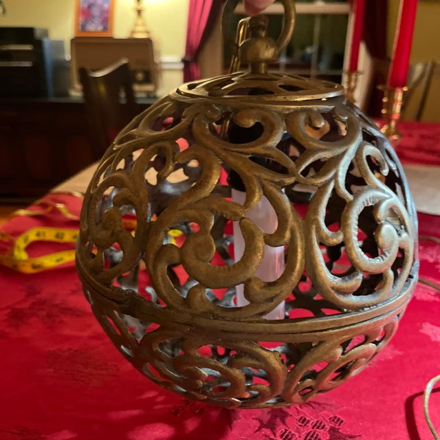 Brass Mid-Century modern Pendant light. Measures 13” high and 25” round. It is in good condition and casts a beautiful...