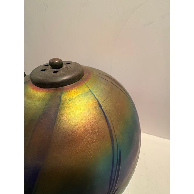 Gorgeous iridescent rainbow colors in this hand blown Lindbergh Studios lamp. I purchased this at the Lindbergh Studios...