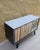 Laminate top in "mist" (light blue with a hint of mauve) Black PU lacquered frame Double lockable doors (key included)