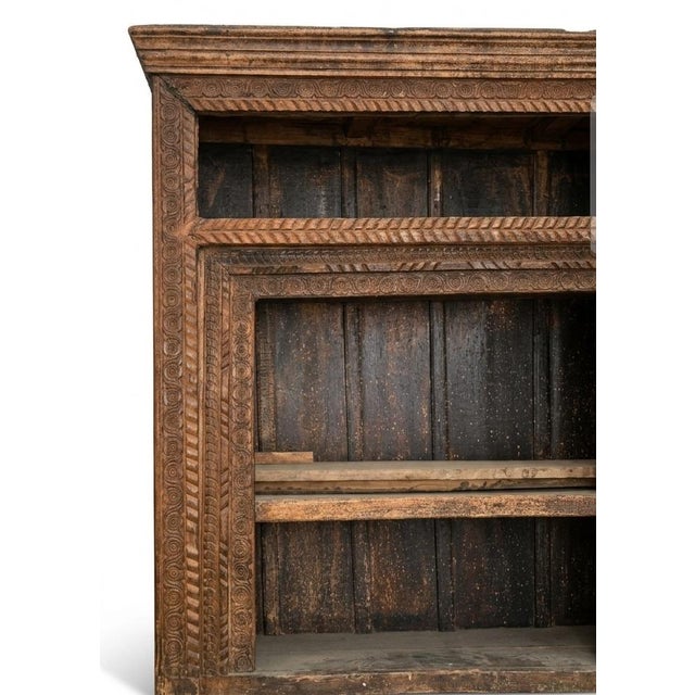 The dense geometric trim, patterned friezes, and rosette motif styling along the outer border are characteristic of...