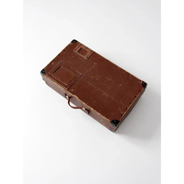 Mid-20th century vintage laundry mailing box in durable brown fiberboard, designed for practical transport and storage....