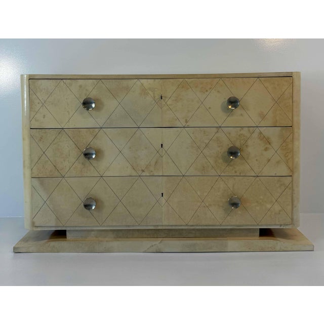 Rare Art Deco chest of drawers produced in Belgium in the late 1940s. The piece is entirely covered in fine natural...