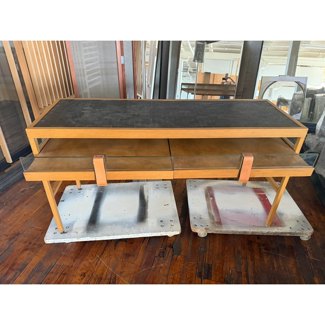This one‑of‑a‑kind custom console table, originally made for a Burberry retail installation, is a sculptural fusion of...