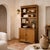 Late 20th-century oak hutch cabinet by Hooker Furniture with open display shelving, a generous work surface, and concealed...